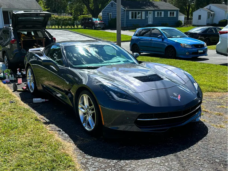 Bright red Corvette exterior with deep glossy shine after premium car detailing service in Beachwood
