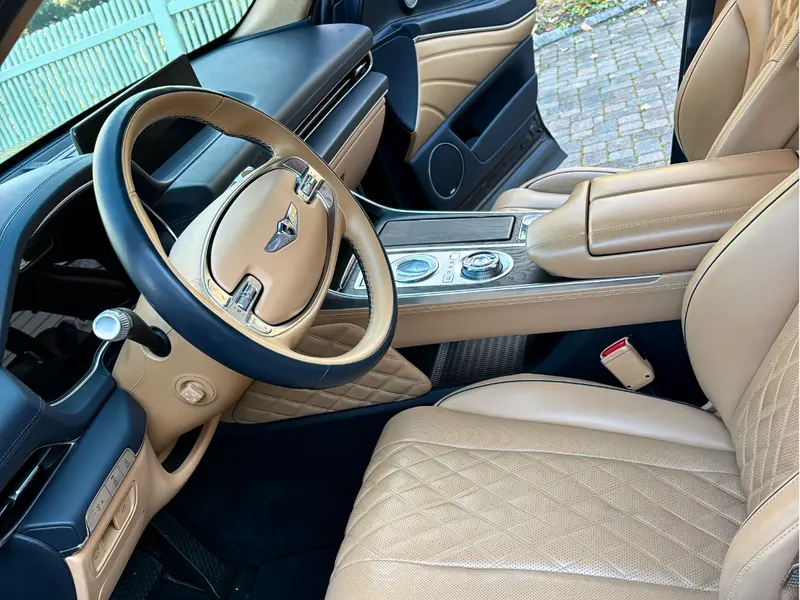 Immaculate Genesis luxury car interior with pristine leather seats and sanitized dashboard after mobile detailing